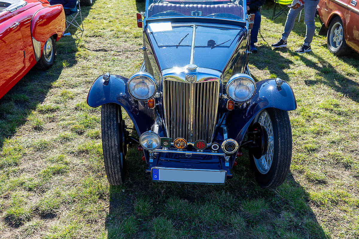 MG